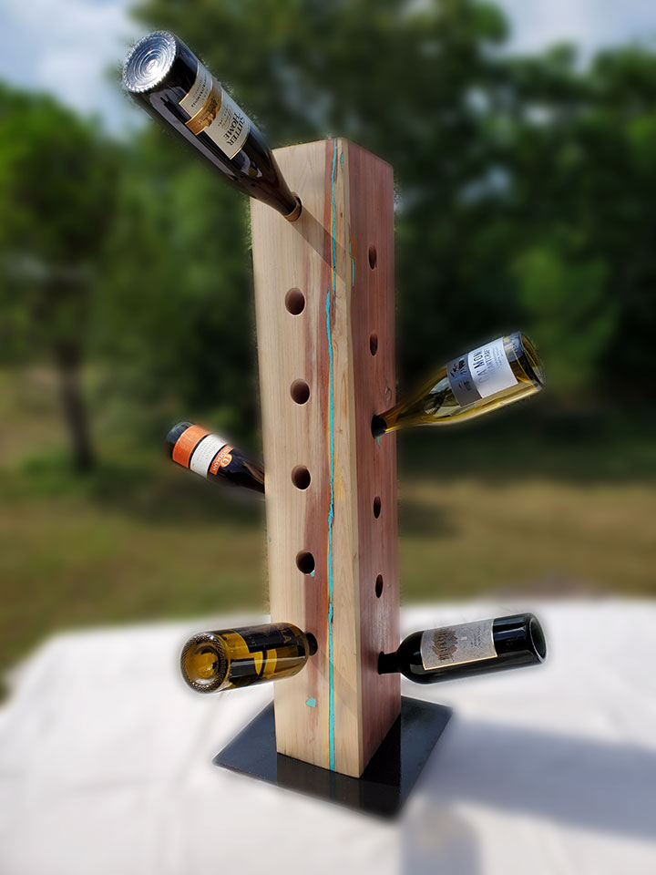 6" x 8" x 3' milled Central Texas cedar timber inlayed with turquoise. This custom wine holder will hold 24 bottle of your favorite wines. Each beam is custom finished with unique turquoise inlays to accent the character of each beam.