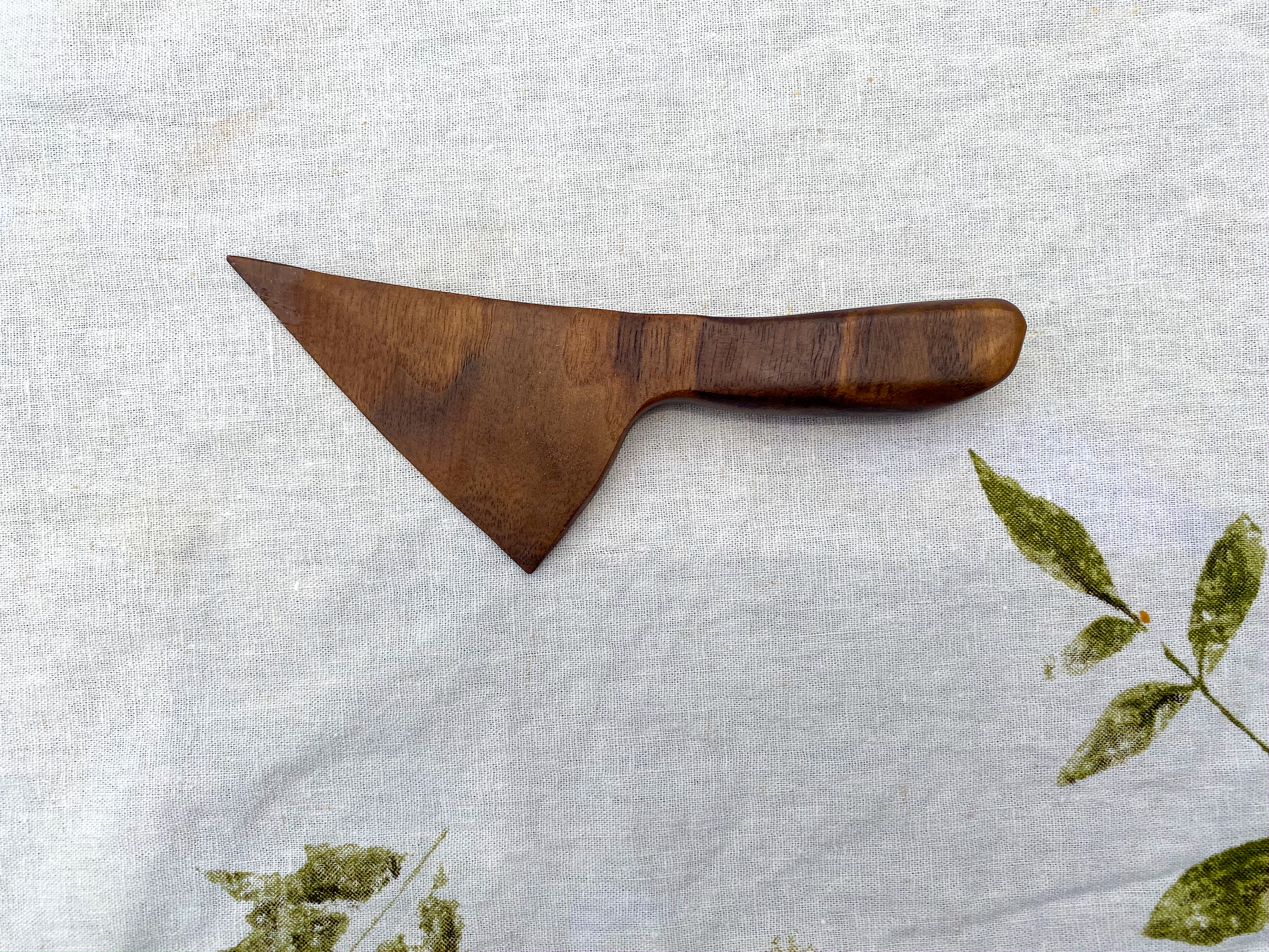 Hand carved 7" x 2 1/2" walnut wood wedge cheese knife.